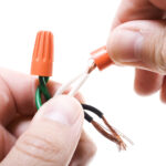 electrician splicing wires together